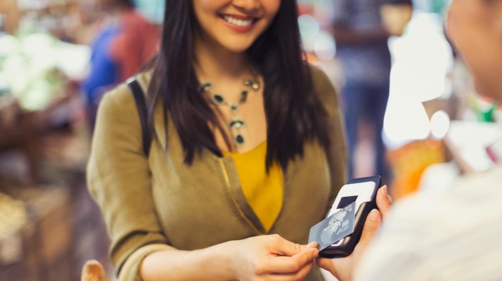 Woman paying with contactless